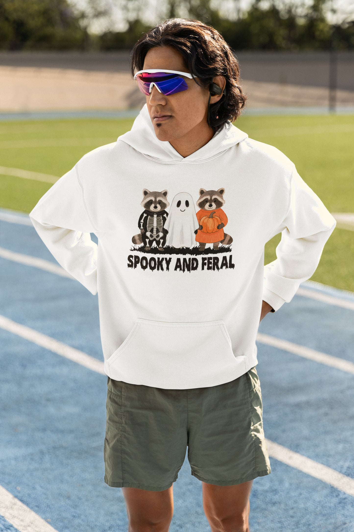 Spooky and Feral Halloween Hoodie with Cute Raccoon and Ghost Design