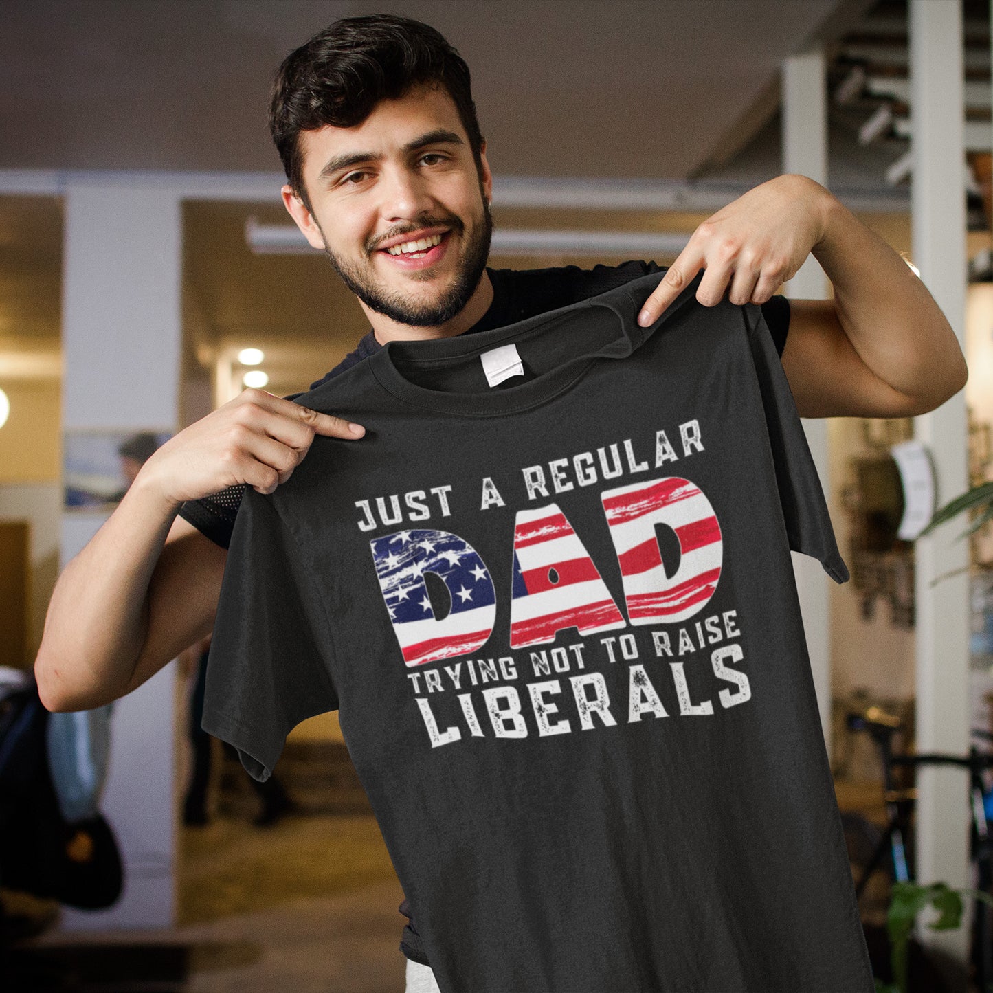 Just a Regular Dad Trying Not to Raise Liberals T-Shirt with American Flag Design