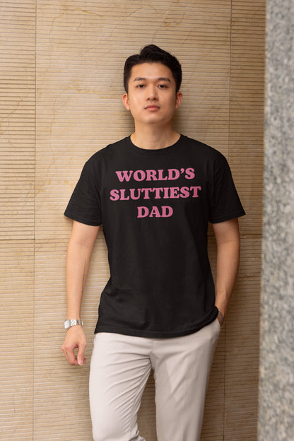 World's Sluttiest Dad Funny Graphic Tee - Bold Pink Text on Black Shirt